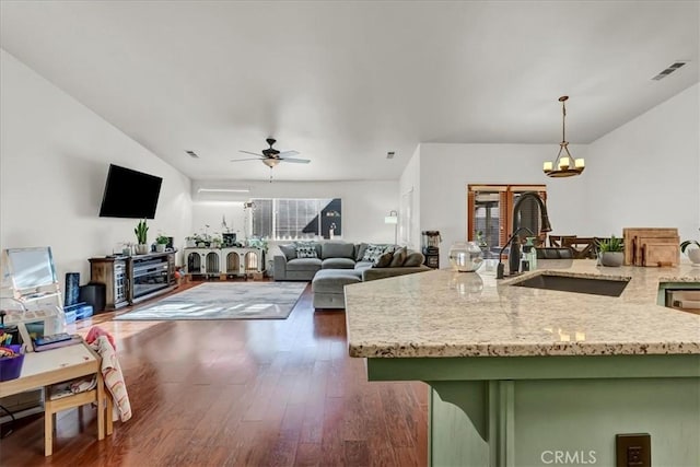 695 Crescent Ln, Lemoore, CA 93245 - living room with a chandelier, wood finished floors, ceiling fan, and lofted ceiling