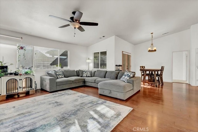 695 Crescent Ln, Lemoore, CA 93245 - living room featuring vaulted ceiling, wood finished floors, and a ceiling fan