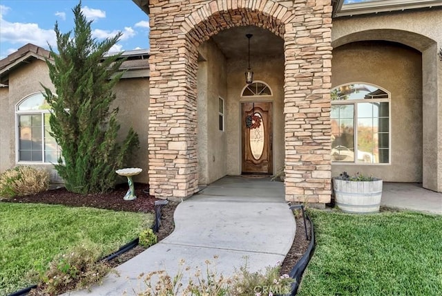695 Crescent Ln, Lemoore, CA 93245 - view of exterior entry featuring stucco siding and stone siding