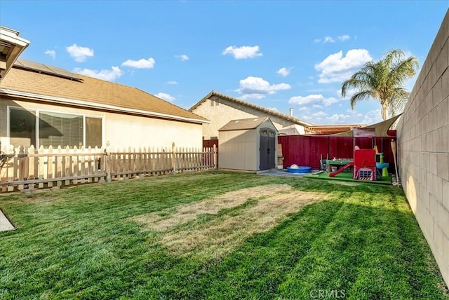 695 Crescent Ln, Lemoore, CA 93245 - fenced backyard featuring a storage shed