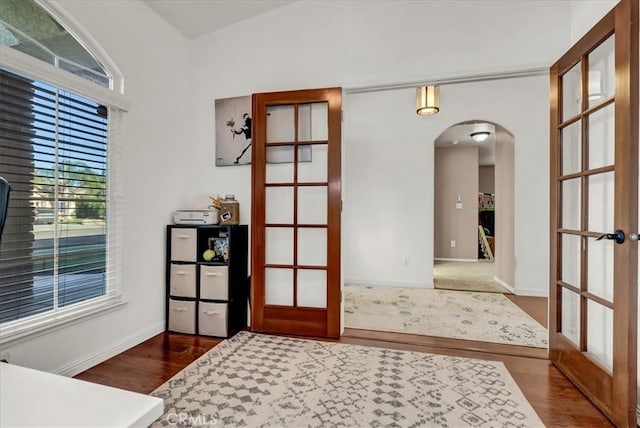 695 Crescent Ln, Lemoore, CA 93245 - entrance foyer featuring arched walkways, french doors, and wood finished floors