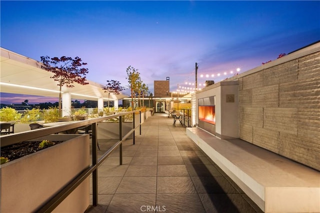 709 E Walnut St Unit 227, Pasadena, CA 91101 - patio terrace at dusk with a lit fireplace