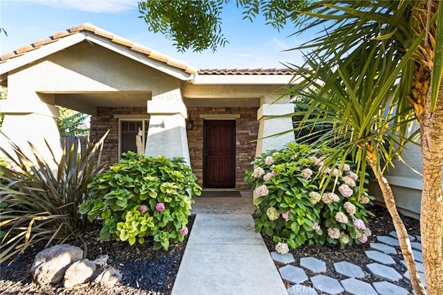 2092 Betsy Ross Ct, Atwater, CA 95301 - entrance to property with stucco siding, a tile roof, and stone siding