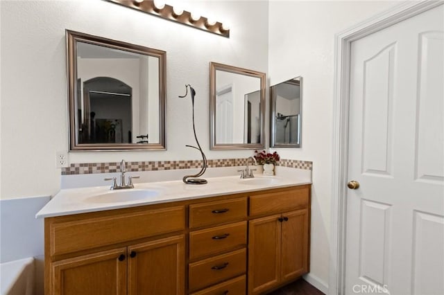 2092 Betsy Ross Ct, Atwater, CA 95301 - bathroom with double vanity, decorative backsplash, and a tub