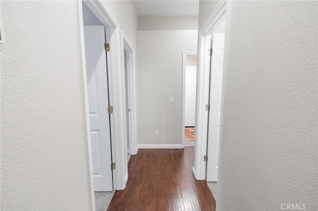 2092 Betsy Ross Ct, Atwater, CA 95301 - corridor featuring dark wood finished floors and a textured wall