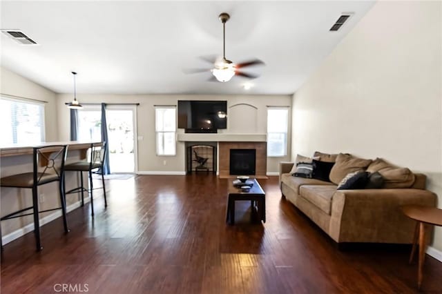 2092 Betsy Ross Ct, Atwater, CA 95301 - living area with ceiling fan, dark wood-type flooring, a tile fireplace, and lofted ceiling