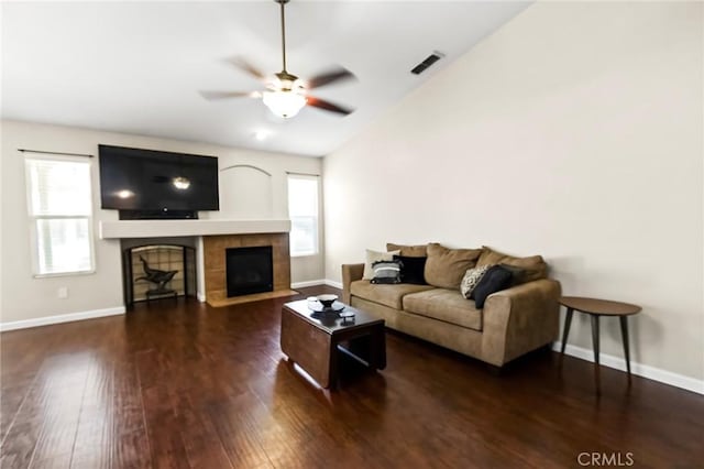 2092 Betsy Ross Ct, Atwater, CA 95301 - living room with a tile fireplace, healthy amount of natural light, wood finished floors, a ceiling fan, and vaulted ceiling