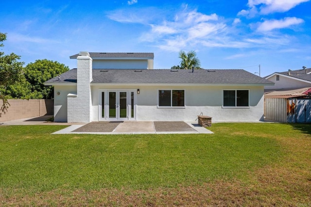 9312 Daisy Ave, Fountain Valley, CA 92708 - rear view of house with french doors, a patio area, stucco siding, a chimney, and roof with shingles