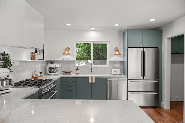 9312 Daisy Ave, Fountain Valley, CA 92708 - kitchen with high end appliances, open shelves, light stone counters, wood finished floors, and recessed lighting