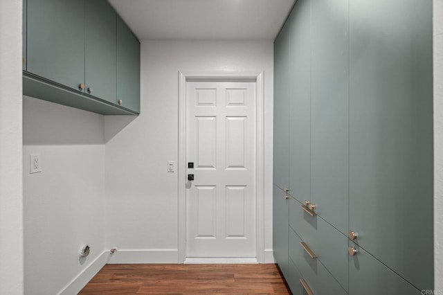 9312 Daisy Ave, Fountain Valley, CA 92708 - laundry area with cabinet space and dark wood-style floors