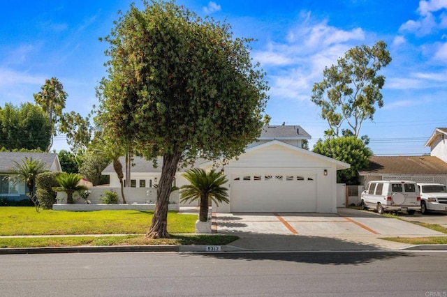 9312 Daisy Ave, Fountain Valley, CA 92708 - view of front of property with driveway, a front yard, and a garage
