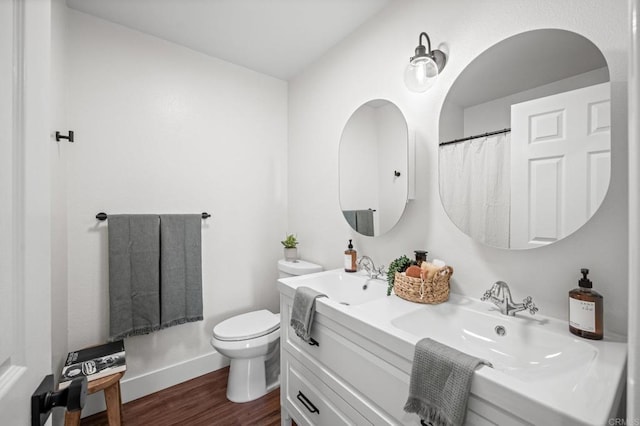 9312 Daisy Ave, Fountain Valley, CA 92708 - bathroom featuring wood finished floors and double vanity
