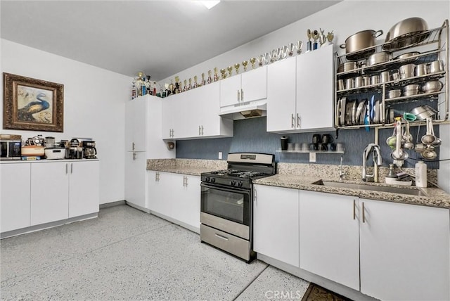 16614 Trailblazer Ave, Chino, CA 91708 - kitchen with appliances with stainless steel finishes, under cabinet range hood, white cabinetry, and light stone countertops