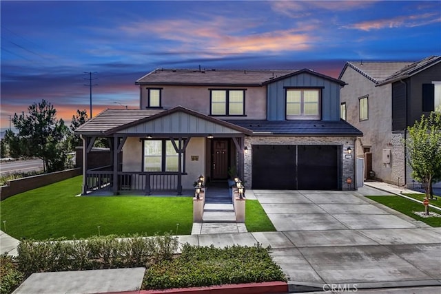 16614 Trailblazer Ave, Chino, CA 91708 - traditional home featuring covered porch, concrete driveway, a front lawn, an attached garage, and board and batten siding