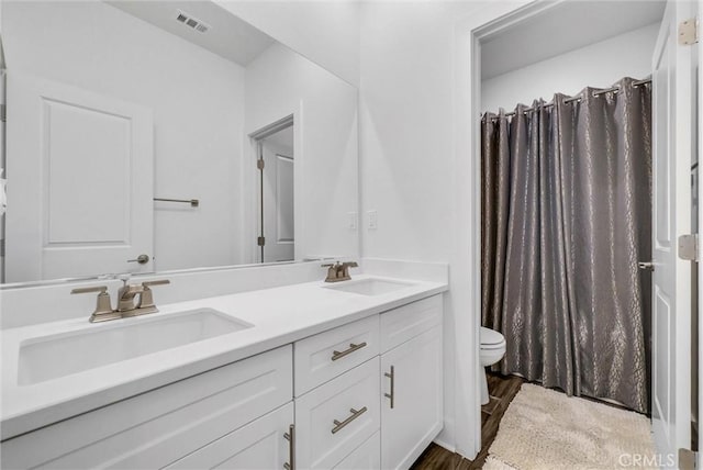 16614 Trailblazer Ave, Chino, CA 91708 - full bath with double vanity, wood finished floors, and a shower with curtain