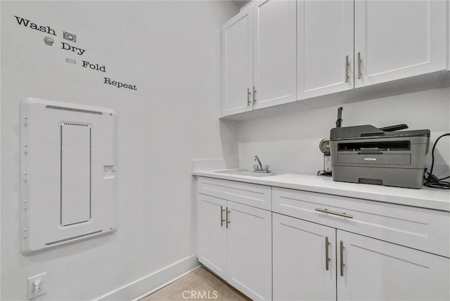 16614 Trailblazer Ave, Chino, CA 91708 - laundry room with a sink and baseboards