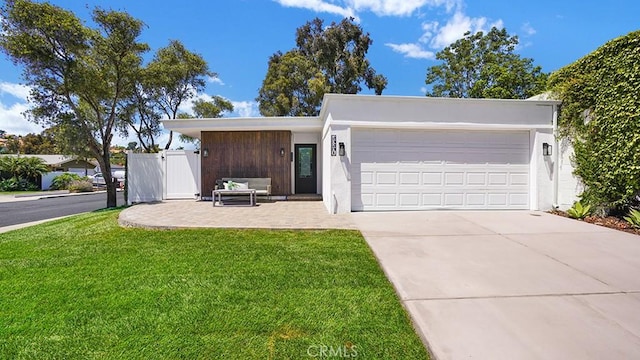23231 Cheswald Dr, Laguna Niguel, CA 92677 - mid-century inspired home featuring concrete driveway, a garage, and a front lawn