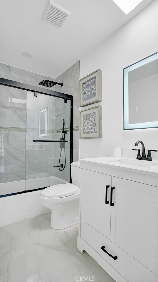 23231 Cheswald Dr, Laguna Niguel, CA 92677 - bathroom featuring vanity, marble finish floors, and enclosed tub / shower combo