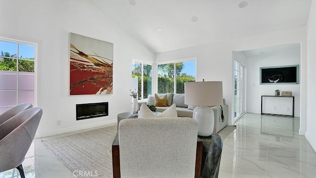 23231 Cheswald Dr, Laguna Niguel, CA 92677 - living room with plenty of natural light, light marble finish floors, a glass covered fireplace, and high vaulted ceiling