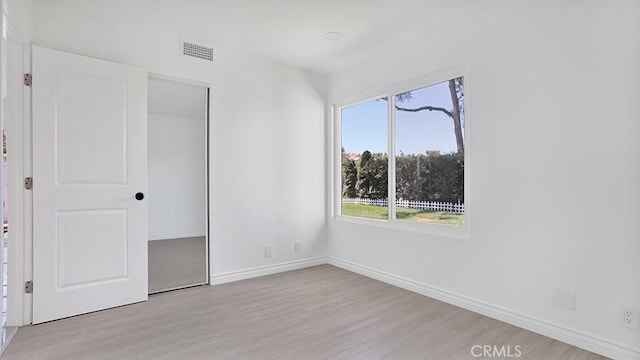 23231 Cheswald Dr, Laguna Niguel, CA 92677 - unfurnished bedroom featuring light wood-type flooring, multiple windows, and a closet