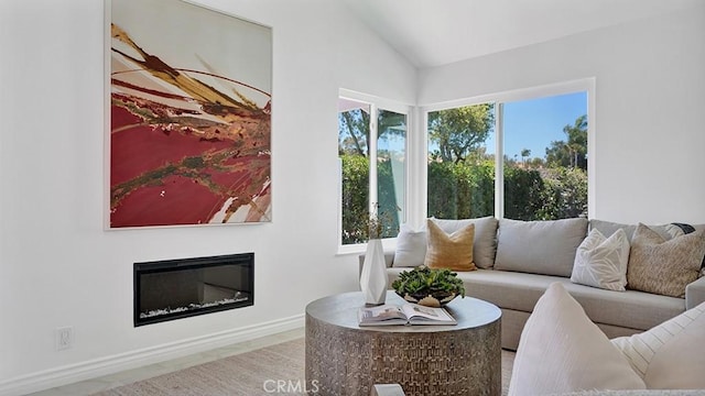 23231 Cheswald Dr, Laguna Niguel, CA 92677 - living room with lofted ceiling, healthy amount of natural light, and a glass covered fireplace