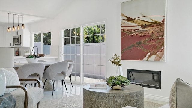 23231 Cheswald Dr, Laguna Niguel, CA 92677 - dining area with a glass covered fireplace and baseboards