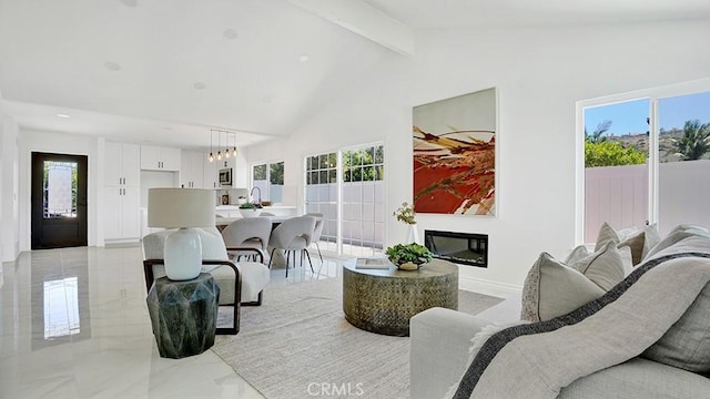 23231 Cheswald Dr, Laguna Niguel, CA 92677 - living room featuring plenty of natural light, a glass covered fireplace, and light marble finish floors
