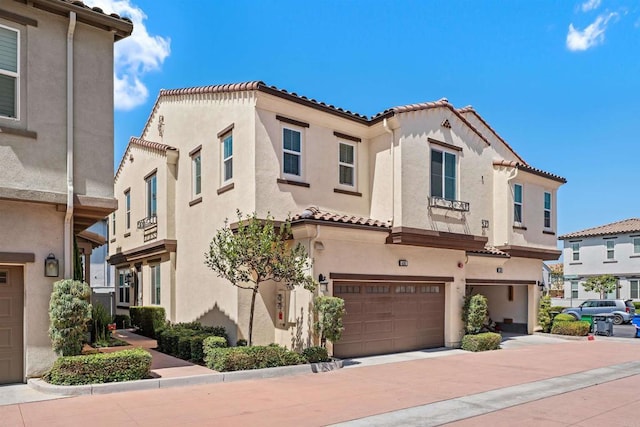 4192 Camino Campana, Oceanside, CA 92057 - mediterranean / spanish home featuring a tile roof, a garage, stucco siding, and concrete driveway