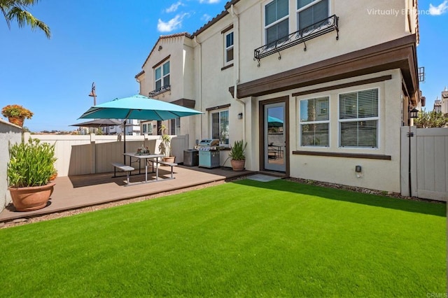 4192 Camino Campana, Oceanside, CA 92057 - back of property with stucco siding and a wooden deck