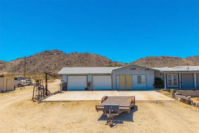 5177 Avenida Del Sol, Joshua Tree, CA 92252 - single story home featuring a mountain view, a garage, french doors, and driveway