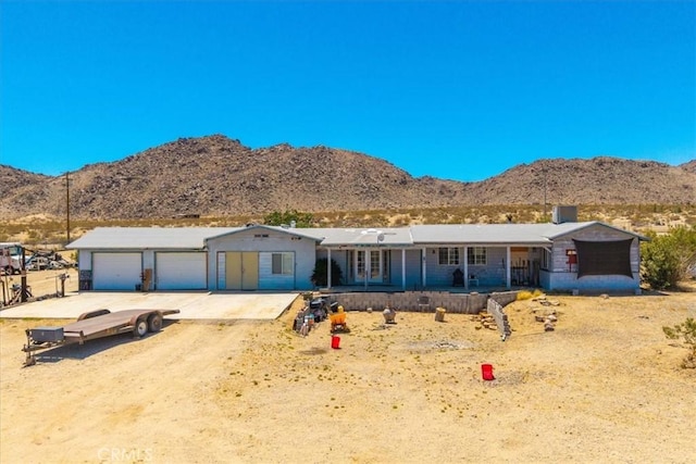 5177 Avenida Del Sol, Joshua Tree, CA 92252 - ranch-style house with a mountain view, driveway, and a porch