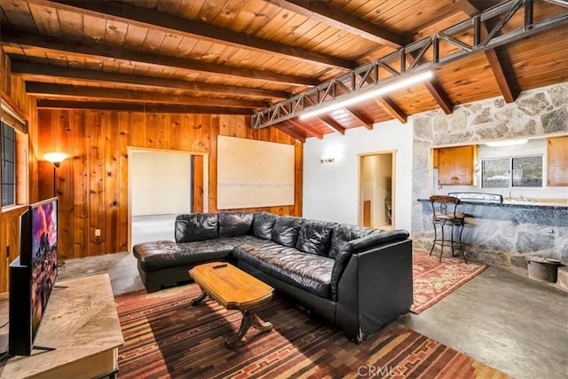 5177 Avenida Del Sol, Joshua Tree, CA 92252 - living area featuring wood ceiling, finished concrete flooring, and wood walls