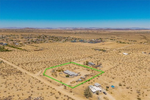 5177 Avenida Del Sol, Joshua Tree, CA 92252 - aerial view of sparsely populated area featuring a mountain backdrop and property parcel outlined