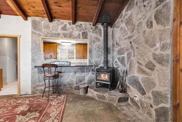 5177 Avenida Del Sol, Joshua Tree, CA 92252 - detailed view of a wooden ceiling with exposed beams and a wood stove