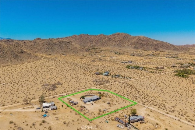 5177 Avenida Del Sol, Joshua Tree, CA 92252 - aerial view of sparsely populated area featuring a mountain backdrop and property parcel outlined
