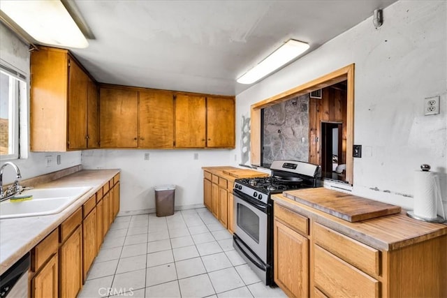 5177 Avenida Del Sol, Joshua Tree, CA 92252 - kitchen featuring appliances with stainless steel finishes, brown cabinets, light countertops, and light tile patterned floors