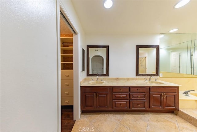6242 Riviera Cir, Long Beach, CA 90815 - bathroom with double vanity, recessed lighting, and a tub to relax in