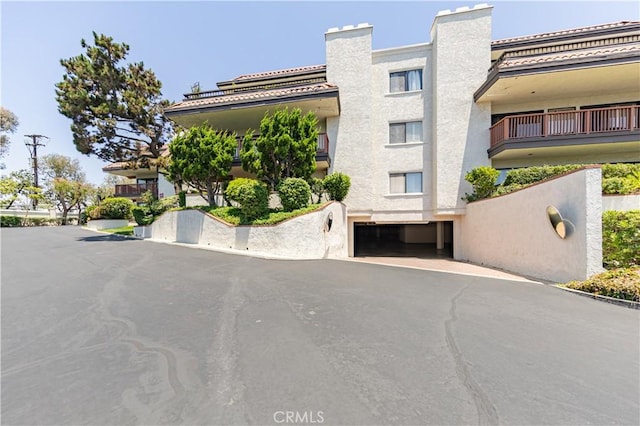 6242 Riviera Cir, Long Beach, CA 90815 - view of property featuring a garage and driveway