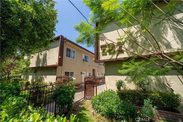719721 N Garfield Ave, Pasadena, CA 91104 - view of property exterior featuring stucco siding and a gate