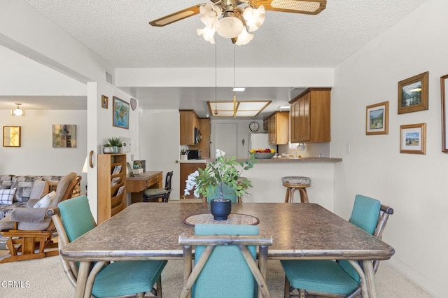 4907 Island View St, Oxnard, CA 93035 - dining area featuring ceiling fan, light colored carpet, and a textured ceiling