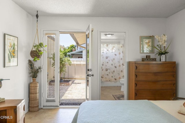 4907 Island View St, Oxnard, CA 93035 - bedroom with access to outside, ensuite bath, and a textured ceiling