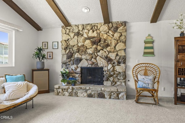 4907 Island View St, Oxnard, CA 93035 - living area featuring beam ceiling, carpet flooring, a textured ceiling, and a fireplace