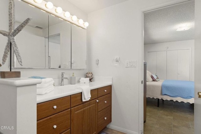 4907 Island View St, Oxnard, CA 93035 - ensuite bathroom with vanity and a textured ceiling