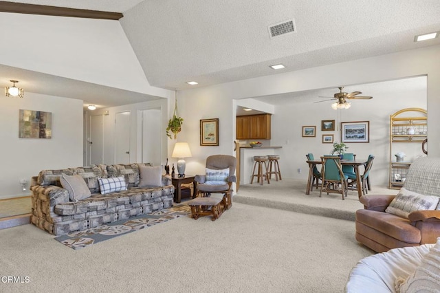 4907 Island View St, Oxnard, CA 93035 - living room with carpet, lofted ceiling, a ceiling fan, and a textured ceiling