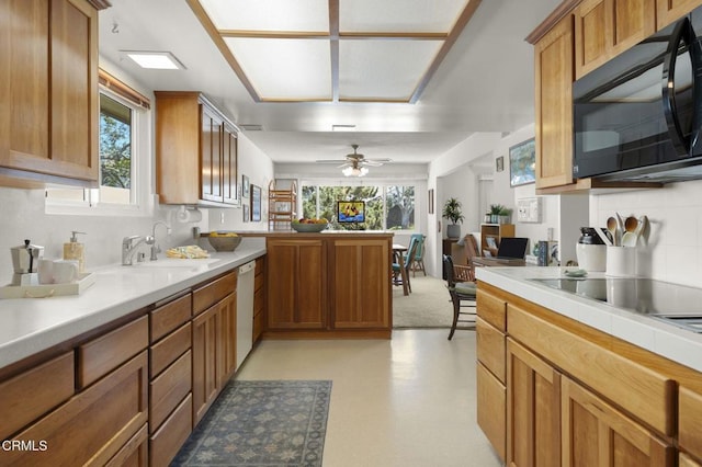 4907 Island View St, Oxnard, CA 93035 - kitchen with black microwave, dishwasher, light countertops, decorative backsplash, and healthy amount of natural light