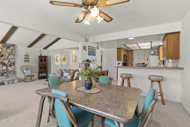 4907 Island View St, Oxnard, CA 93035 - dining space with light carpet, a ceiling fan, and a textured ceiling