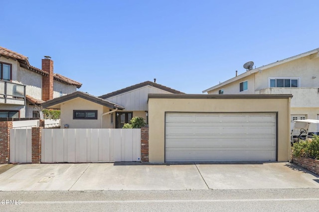 4907 Island View St, Oxnard, CA 93035 - view of front facade featuring stucco siding, concrete driveway, and an attached garage