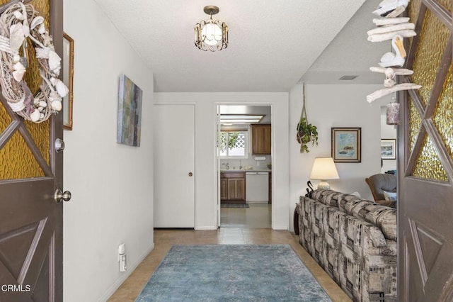 4907 Island View St, Oxnard, CA 93035 - tiled entryway featuring a textured ceiling