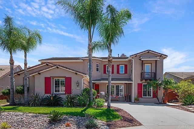 595 S Hidden Trails Rd, Escondido, CA 92027 - view of front of home featuring stucco siding, a balcony, and concrete driveway