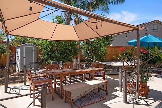 595 S Hidden Trails Rd, Escondido, CA 92027 - fenced backyard featuring outdoor dining space, a storage unit, and a patio area